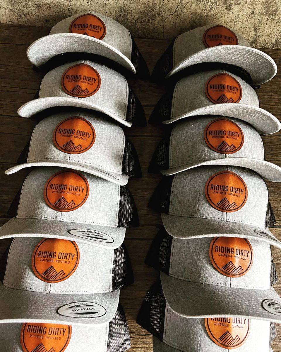 Two rows of matching custom leather patch hats ready to ship